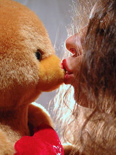 Sexy young girl playing with her teddy