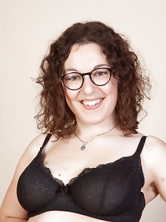 Laying Charmingly On The Couch, Tamar Wears Her Black Dress And Stockings Pictures