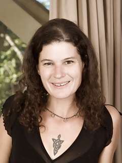 Sunshine Is On Her White Couch In Her Black Blouse And Skirt