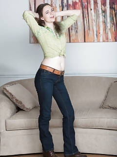 Camille Is By Her Sofa And Stripping Nude