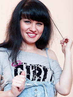 Yana Has On Her Blue Miniskirt And Tee Shirt As She Gets Prepared To Sit On The Sofa