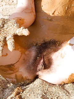 Erika Has A Day At The Sandy Beach And Covers Her Seductive Nude Body With Moist Sand