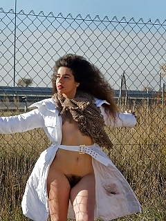 Curvacious Hairy Black-haired Peeing In Urban Place