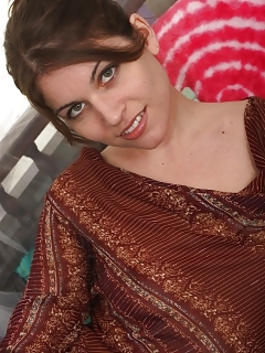 Sinful Holly Has A Giant Surprise For You! Its Her Piquant Hairy Muff. Watch Her Lift Her Dress And Spread In Her Solarium.