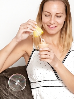 Kristina Bud Is Blowing Bubbles On Her Chair, And Enjoying Her Day