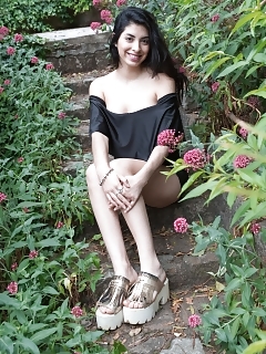 Ornella Sits In Her Back Yard Smiling, And In Her New Black Gown Pictures