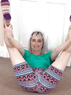 Esme Is Stripping By Her Pouf Where She Strips Nude