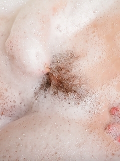 Irina V Has Had A Long Bad Day...now She Decides A Sensitive Soak In The Bathtub, But Not Without Pleasuring Her Hairy Cooter First.